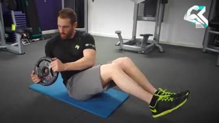 آموزش حرکت بدنسازی چرخش کمر با صفحه وزنه (شکم)
