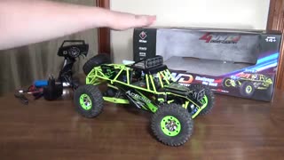 ماشین کنترلی WL Toys 12428 ( وی ال تویز ) صخره نورد با کمک فنر هایی قوی